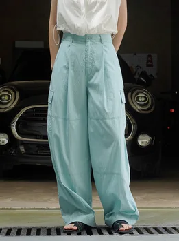 модные женские классические брюки с большими карманами и складками